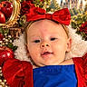 baby, child, snow_white_costume, red_bow, blue_dress, red_sleeves, portrait, smiling, indoors, fairytale, castle, roses, apples, mirror, floral_background, storybook, costume, infant, face, safe