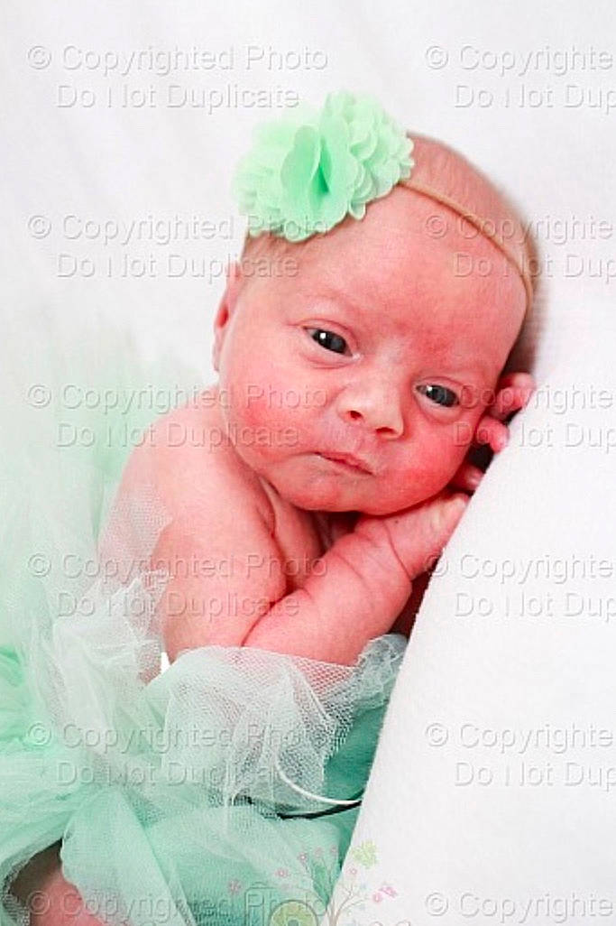 Brailyn Roberson is registered to the contest to win money with this photo: baby, baby_products, baby_toddler_clothing, cheek, child, costume, face, fashion_accessory, hair_accessory, head, headband, headgear, headpiece, linens, person, pink, product, textile, toddler