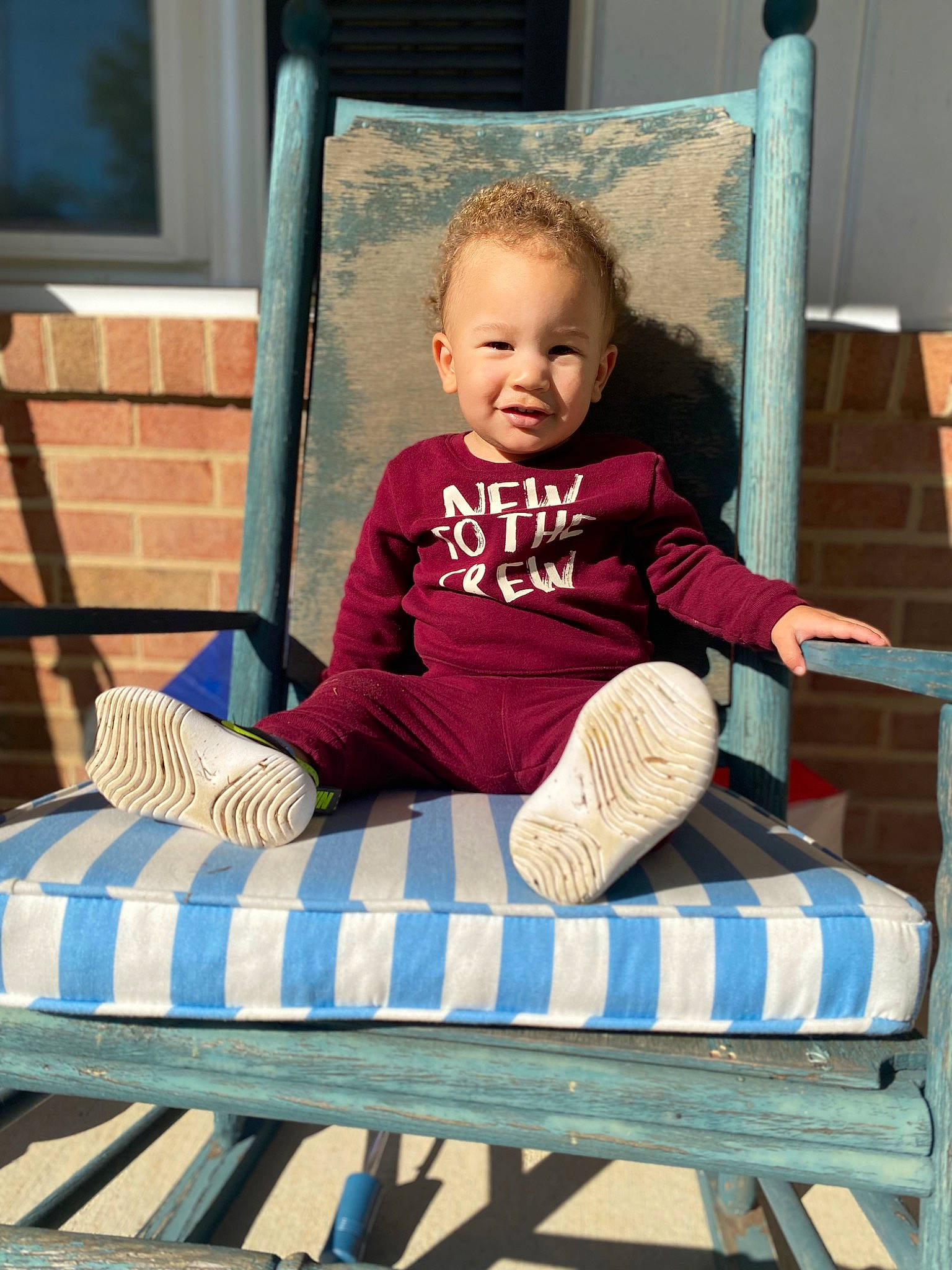 Franklin is registered to the contest to win money with this photo: arm, baby, baby_toddler_clothing, chair, child, clothing, comfort, face, green, human_body, leisure, outdoor_furniture, person, pink, product, shoe, smile, sneakers, summer, toddler