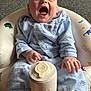 baby, baby_seat, blue_pajamas, bottle_holder, carpet, child, comfort, crying, cute, expression, footwear, home, indoor, infant, pattern, person, sitting, sock, yawning, young_child