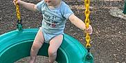 Dustin joined the competition — help win amazing prizes! baby, tire_swing, playground, yellow_chain, blue_onesie, outdoor, child, park, wood_chips, swing, barefoot, trees, sunlight, grass, play_equipment, infant, summer, daytime, cute, smiling