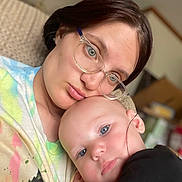 Dustin joined the competition — help win amazing prizes! baby, child, person, glasses, cuddle, close_up, portrait, indoor, face, skin, head, eyewear, expression, love, comfort, human, young, parent, affection, casual_clothing