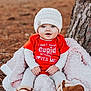 baby, blanket, blue_eyes, boots, child, clothing, cozy, cute, fall, grass, infant, knit_hat, nature, outdoors, pink_blanket, portrait, red_onesie, sitting, smile, tree_trunk