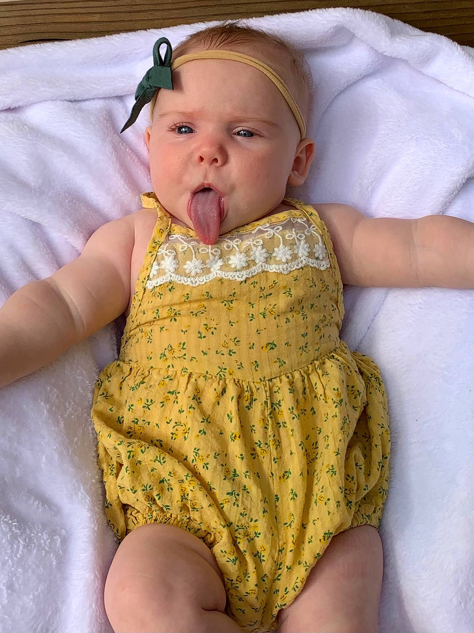 Hattie is registered to the contest to win money with this photo: baby, baby_toddler_clothing, cheek, child, dress, embellishment, eye, face, finger, hair, head, headgear, iris, lip, neck, person, skin, sleeve, thigh, toddler