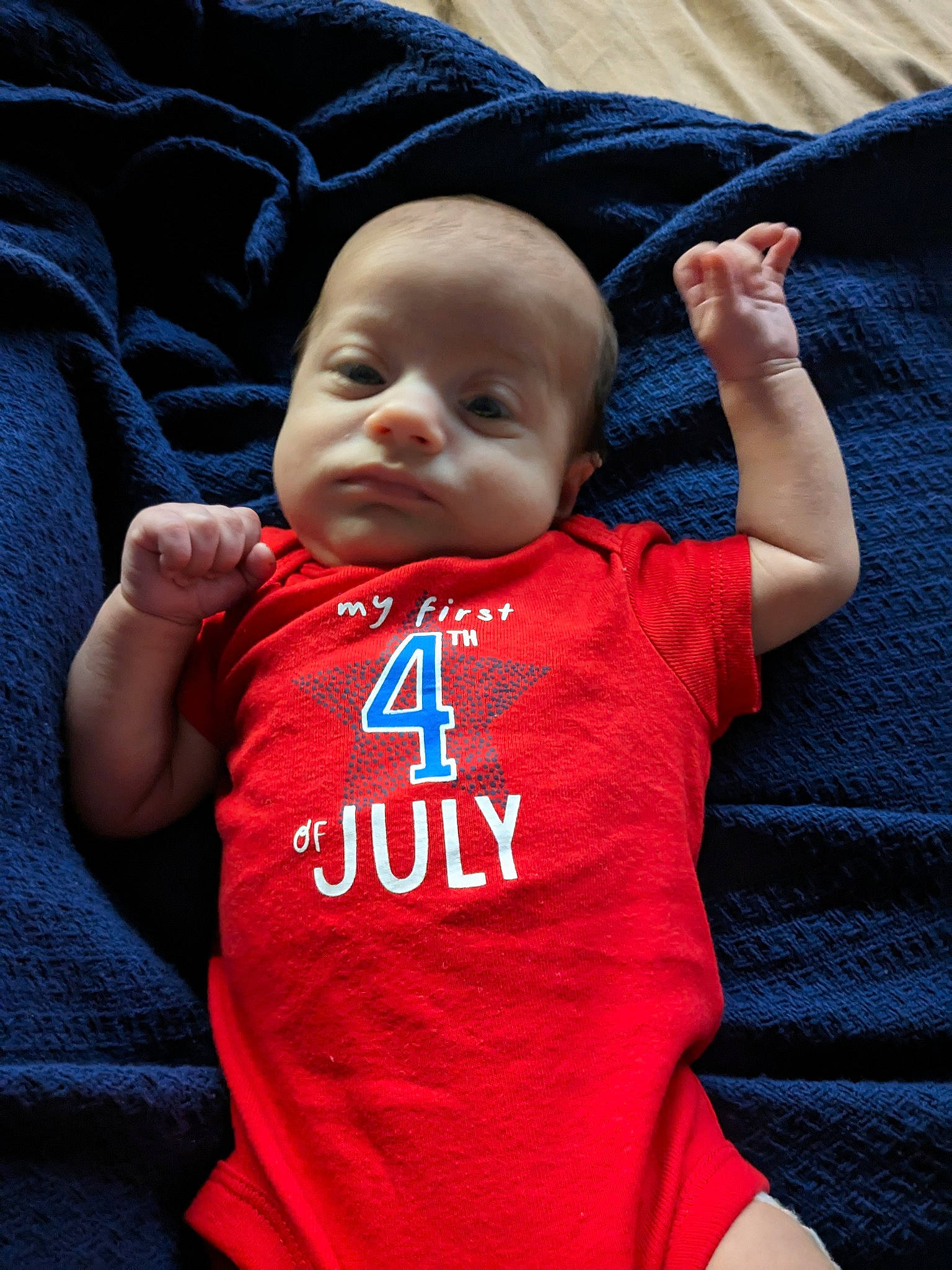 Cayde joined the competition — help win amazing prizes! baby, baby_toddler_clothing, cheek, child, comfort, cool, electric_blue, finger, gesture, happy, jersey, leisure, linens, magenta, person, sitting, sleeve, sportswear, t_shirt, textile