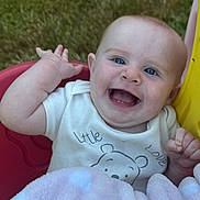 Hazel Mae is registered to the contest to win money with this photo: baby, smiling, blue_eyes, blanket, swing, outdoor, grass, cute, infant, child, happy, clothing, face, person, play, joyful, head, expression, toddler, fun
