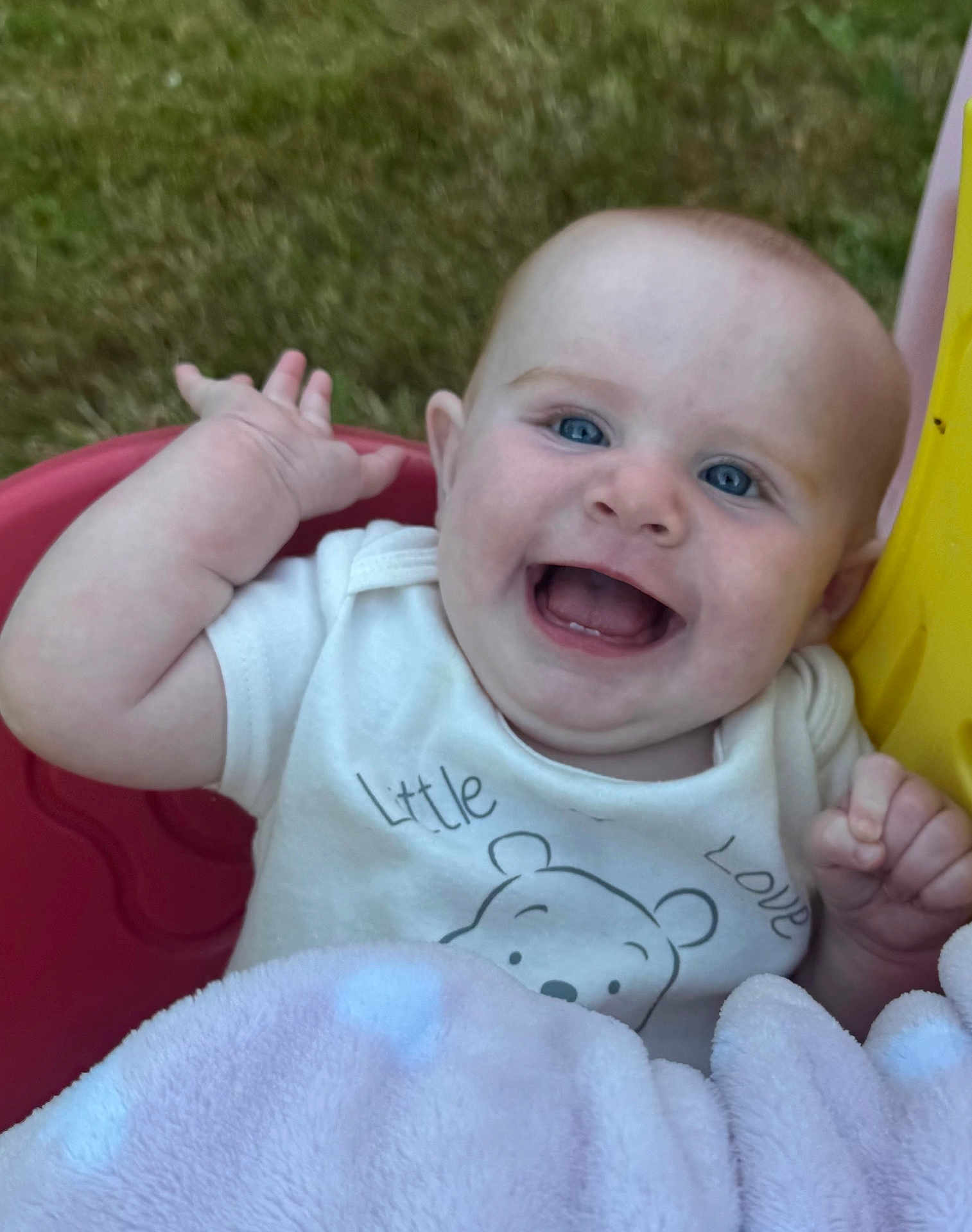 Hazel Mae is registered to the contest to win money with this photo: baby, smiling, blue_eyes, blanket, swing, outdoor, grass, cute, infant, child, happy, clothing, face, person, play, joyful, head, expression, toddler, fun