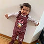 Lilya participe au concours pour gagner de l'argent avec cette photo : toddler, child, smiling, standing, overalls, daisy_duck, long_sleeve_shirt, curly_hair, happy, indoor, wooden_floor, wall, shoes, playful, cute, person, fashion, footwear, toy_ball, home