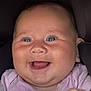 baby, smiling, face, blue_eyes, pink_clothing, infant, closeup, happy, chubby_cheeks, portrait, child, cute, joyful, person, skin, young_child, indoors, head, expression, baby_girl