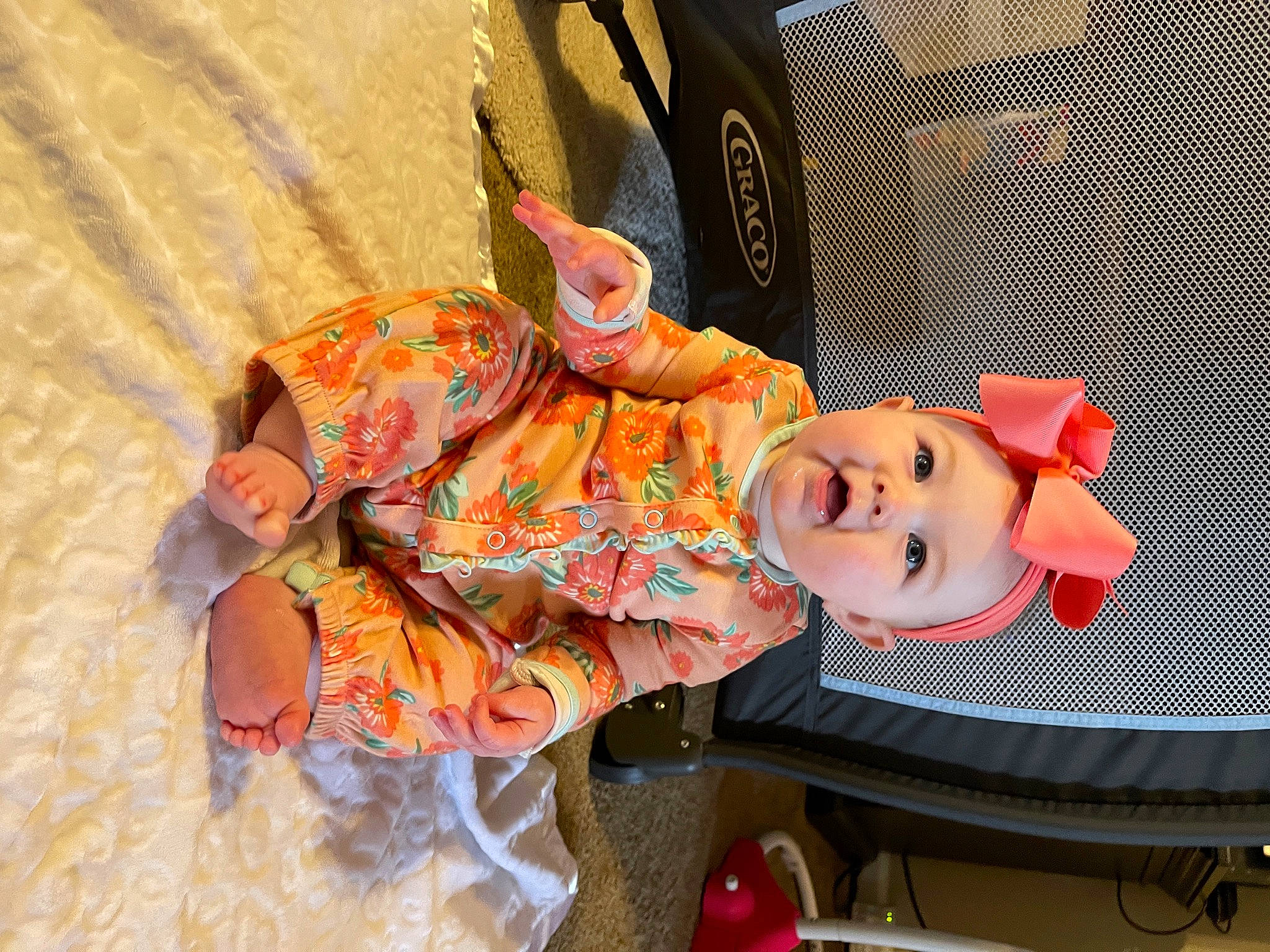 Genevieve is registered to the contest to win money with this photo: baby, baby_products, child, costume, fun, hat, headwear, leisure, orange, peach, person, plastic, room, stuffed_toy, toddler, toy