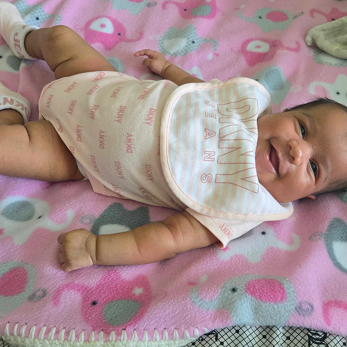 Savannah is registered to the contest to win money with this photo: baby, bed, blanket, bodypart, bonnet, clothing, diaper, face, finger, furniture, glove, hand, hat, head, homedecor, newborn, person, photography, portrait, quilt