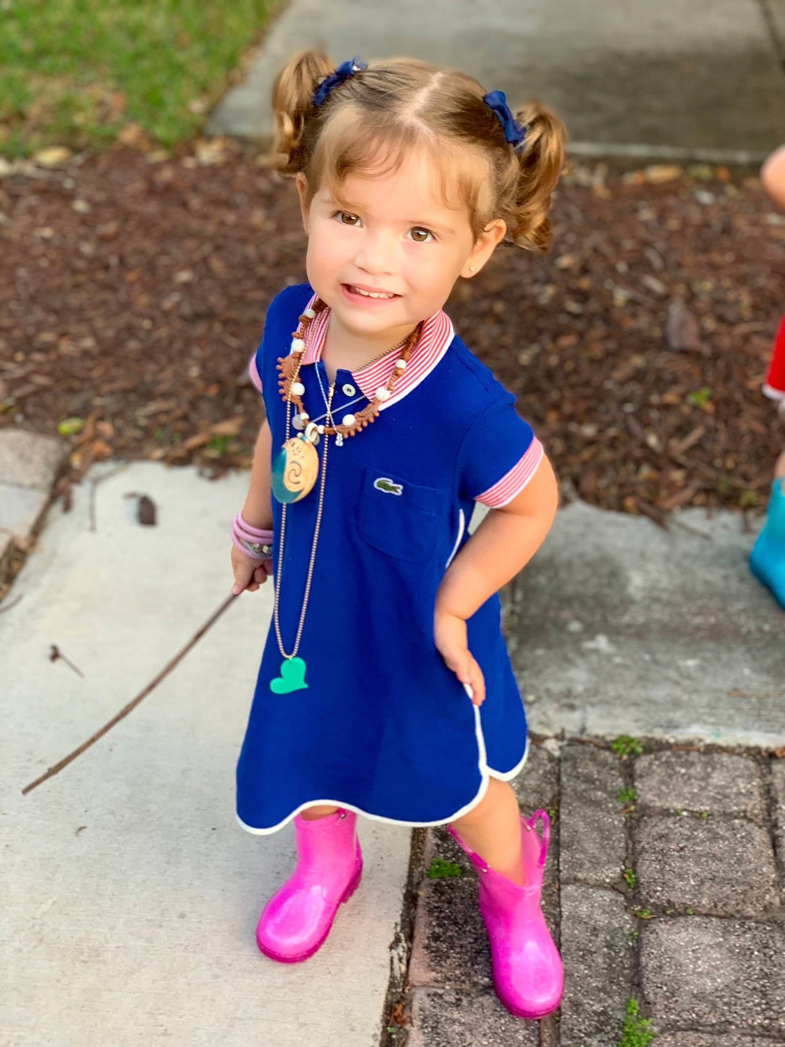 Alejandra is registered to the contest to win money with this photo: azure, baby_toddler_clothing, blue, child, electric_blue, eye, face, footwear, fun, grass, hair, happy, head, joy, person, purple, recreation, sleeve, smile, sneakers