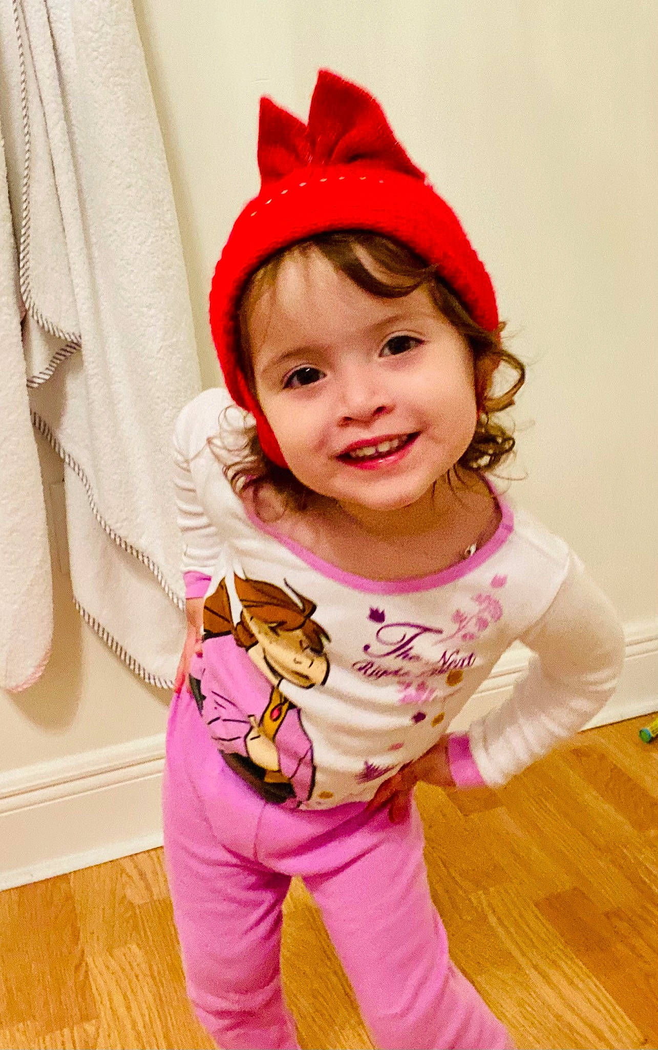 Beatriz is registered to the contest to win money with this photo: baby, baby_toddler_clothing, cap, child, clothing, costume_hat, flooring, happy, head, human_body, joy, magenta, orange, outerwear, person, pink, purple, red, skin, sleeve