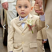 Sloan a rejoint le concours — aidez-le/la à gagner de superbes lots ! boutonniere, bow_tie, boy, celebration, child, childhood, curious, cute, event, fashion, flower, formal_wear, groom, hand_holding, outdoor, people, person, portrait, small_child, suit