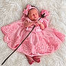 newborn, baby, sleeping, portrait, pink_dress, flower, rose, headband, bow, lace, tulle, skirt, fluffy_blanket, white_background, infant, hands, feet, posed, studio_photography, cute