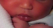 Amoura Lee is registered to the contest to win money with this photo: newborn, baby, infant, sleeping, portrait, face, eyes_closed, nose, mouth, cheek, hand, finger, swaddled, blanket, white_blanket, close_up, indoors, peaceful, cuddled, photography