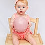 Grace is registered to the contest to win money with this photo: baby, child, infant, pink_bow, pink_ball, wooden_chair, romper, blue_eyes, sitting, cute, portrait, indoor, studio_lighting, soft_skin, hands, feet, expression, headband, toy, innocence
