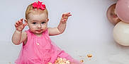 Grace joined the competition — help win amazing prizes! baby, child, pink_dress, cake, cake_smash, balloons, messy, birthday, celebration, cute, smiling, sitting, food, frosting, crumbs, foot, hand, party, decorations, portrait