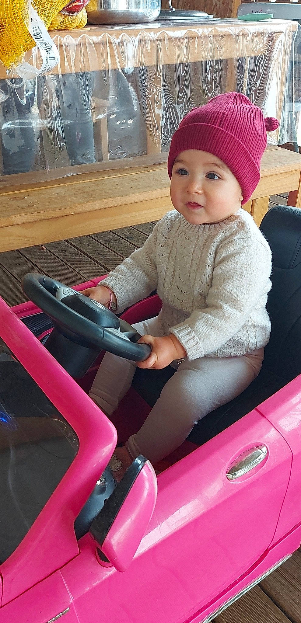 Gillya participe au concours pour gagner de l'argent avec cette photo : auto_part, automotive_design, automotive_exterior, baby_toddler_clothing, cap, comfort, hand, headwear, hood, lap, leg, magenta, motor_vehicle, person, pink, red, smile, steering_wheel, thigh, toddler