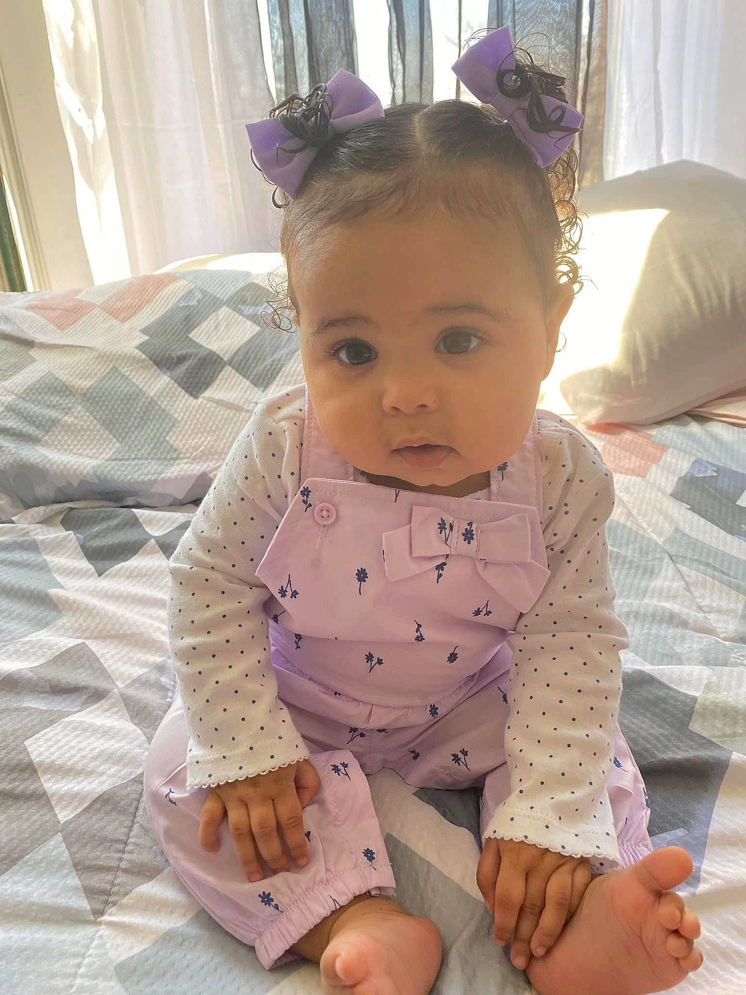 Everly is registered to the contest to win money with this photo: arm, baby, baby_toddler_clothing, cheek, clothing, comfort, dress, eye, hair, hand, head, human_body, joint, neck, person, product, shoulder, skin, sleeve, smile