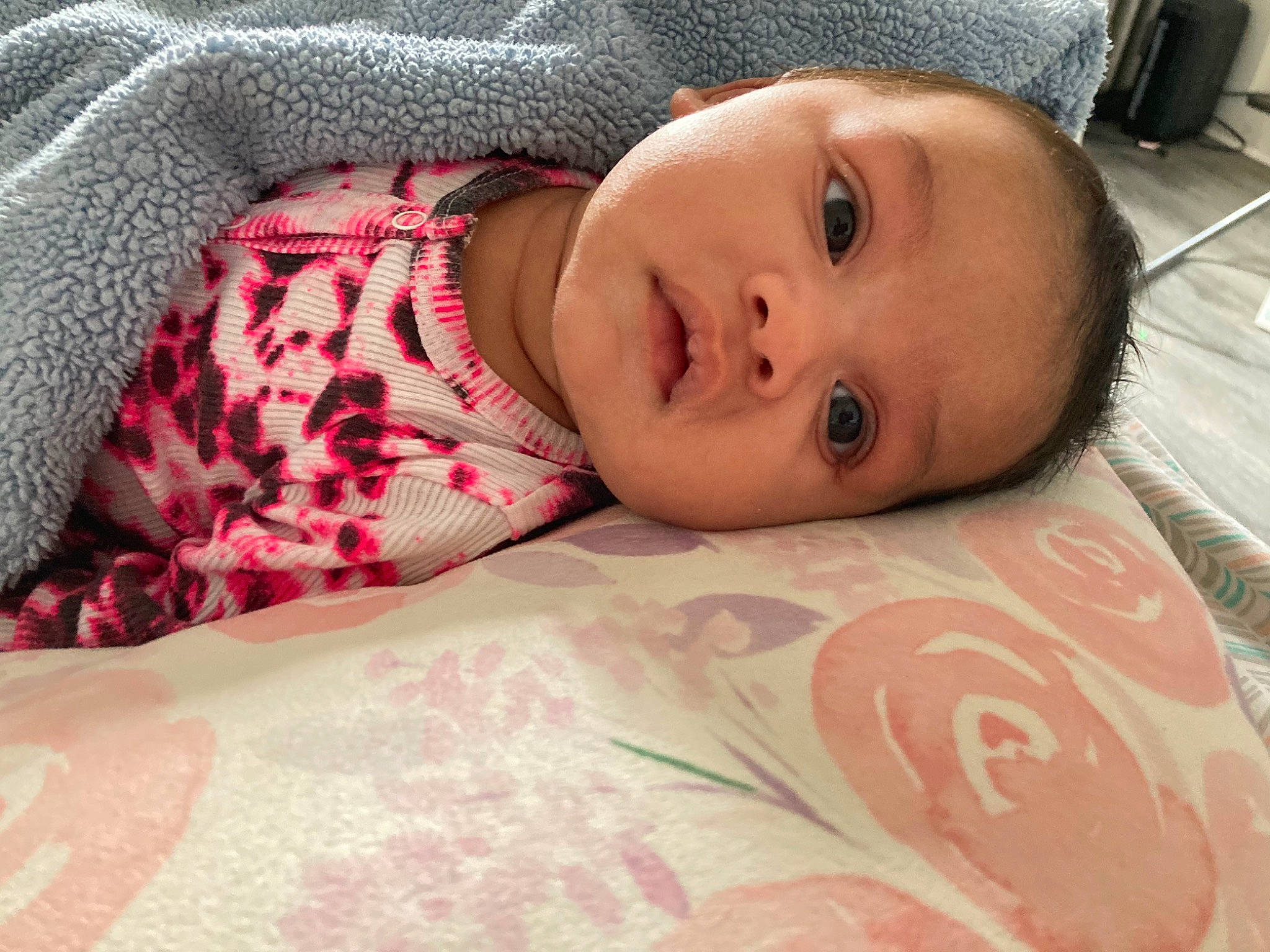 Naylani is registered to the contest to win money with this photo: baby, baby_toddler_clothing, cheek, comfort, eye, eyelash, face, head, human_body, iris, linens, lip, nose, pattern, person, pink, skin, sleeve, smile, toddler