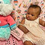 Mila is registered to the contest to win money with this photo: accessories, baby, bracelet, clothing, couch, cushion, dress, face, furniture, head, homedecor, jewelry, necklace, newborn, person, photography, portrait, sitting, toy, wallet