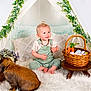 Kimber joined the competition — help win amazing prizes! child, baby, infant, toddler, rabbit, bunny, easter_eggs, basket, carrots, teepee, garland, pillow, fur_rug, overalls, smile, sitting, indoor, wooden_stool, decorative_flowers, portrait