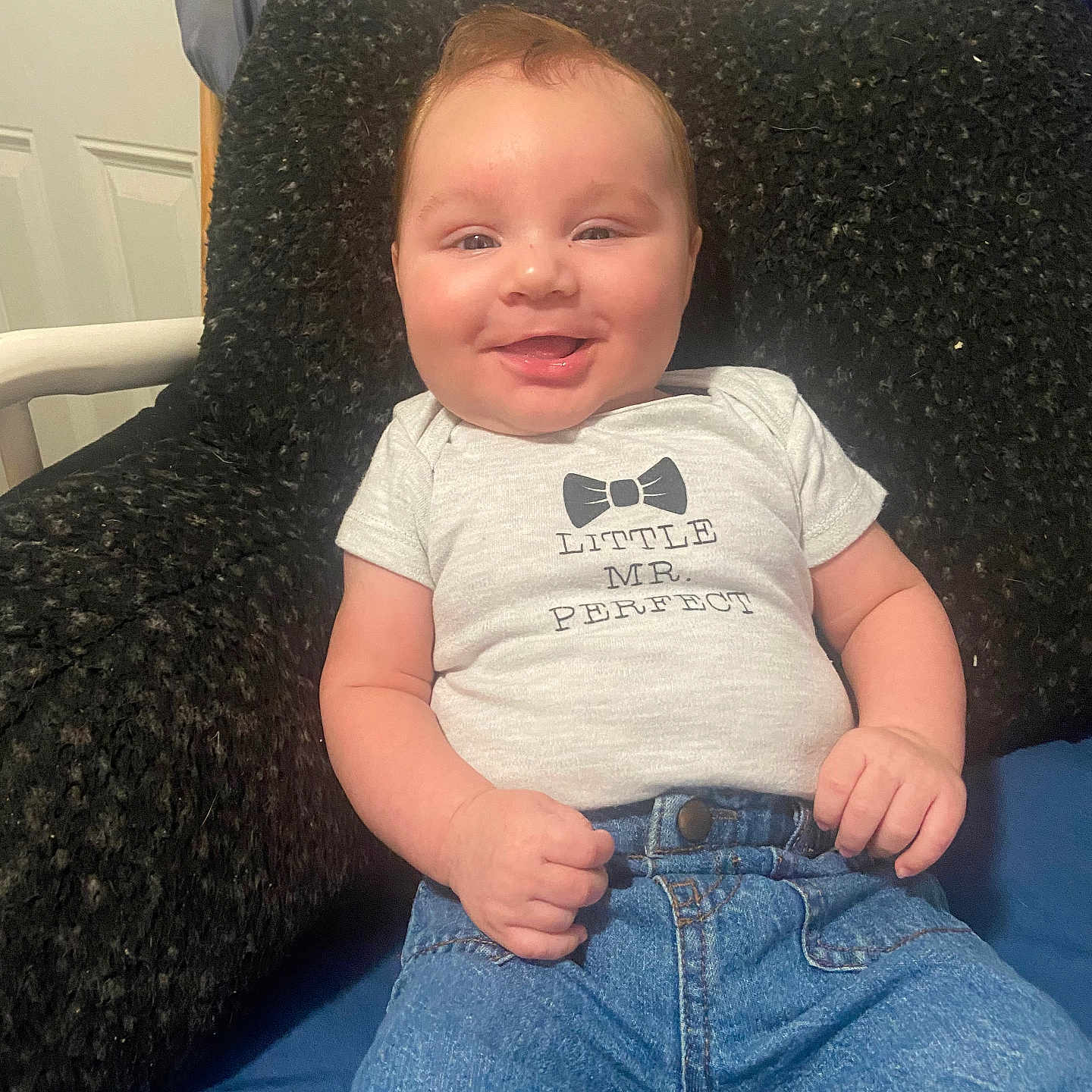 Jaxx is registered to the contest to win money with this photo: architecture, baby, chair, clothing, couch, cushion, face, furniture, happy, head, homedecor, jeans, newborn, pants, person, photography, portrait, sitting, smile, t_shirt