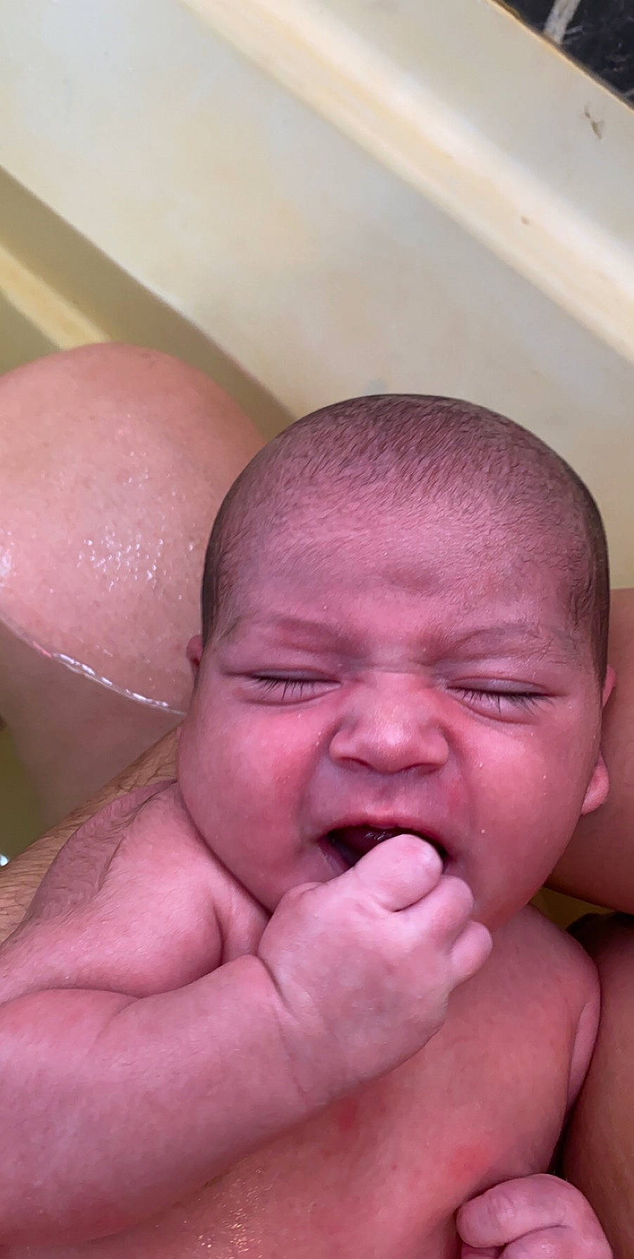 Mateo is registered to the contest to win money with this photo: baby, bathing, cheek, child, face, finger, forehead, hand, head, lip, mouth, muscle, neck, nose, person, skin, sorrow, thumb
