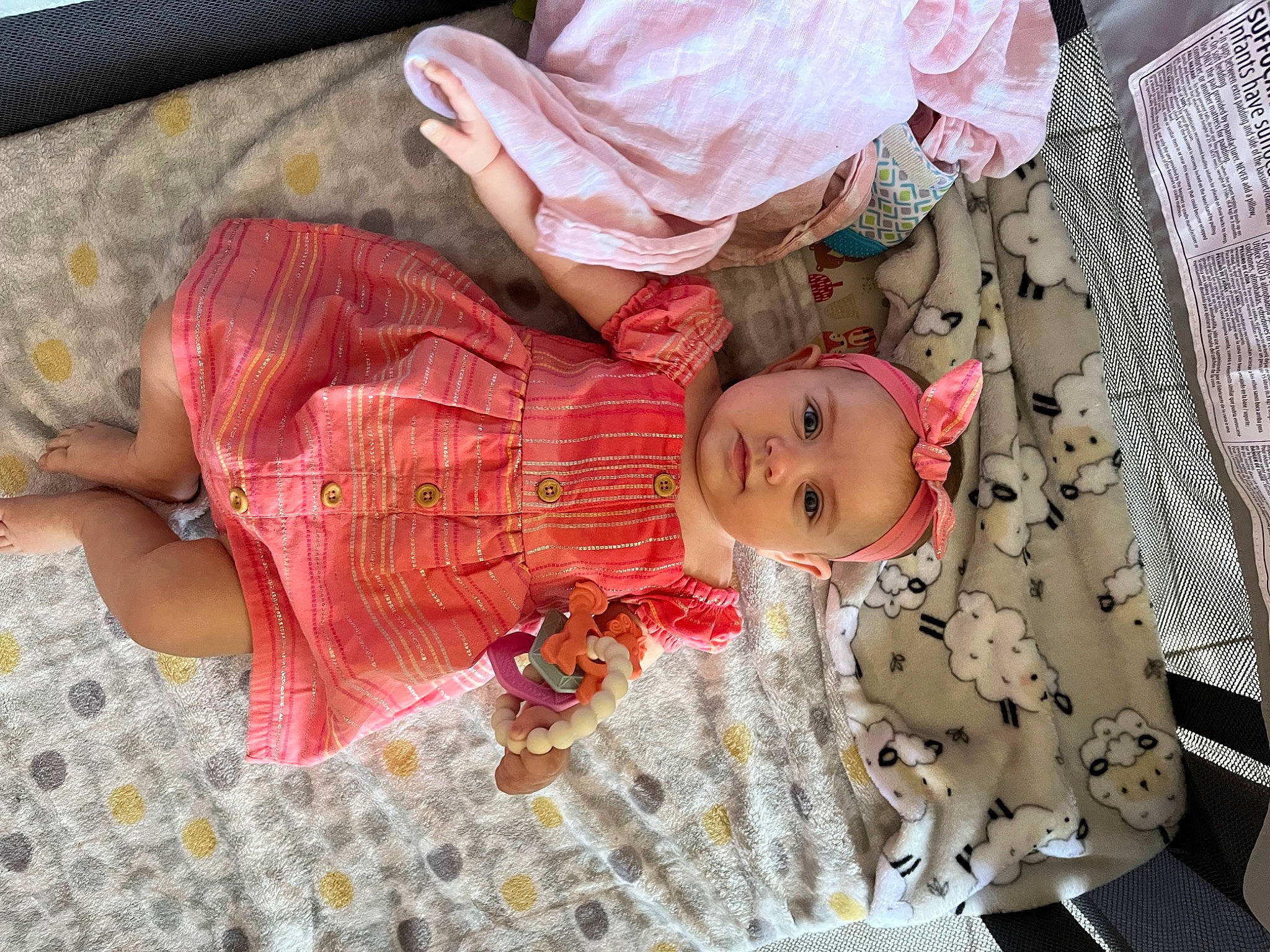 Elliana joined the competition — help win amazing prizes! baby, baby_products, baby_toddler_clothing, cheek, child, comfort, doll, flooring, headwear, linens, pattern, peach, person, pink, room, skin, sleep, sleeve, toddler, wood