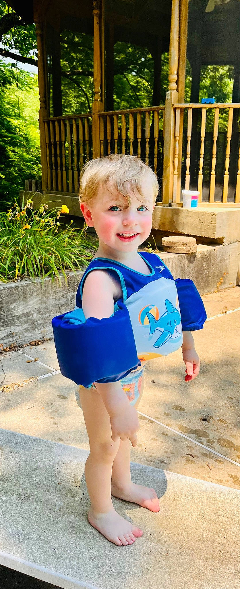 Parker is registered to the contest to win money with this photo: baby_toddler_clothing, child, electric_blue, fun, grass, happy, human_leg, joy, leisure, person, personal_protective_equipment, plant, public_space, recreation, smile, sportswear, standing, summer, t_shirt, thigh