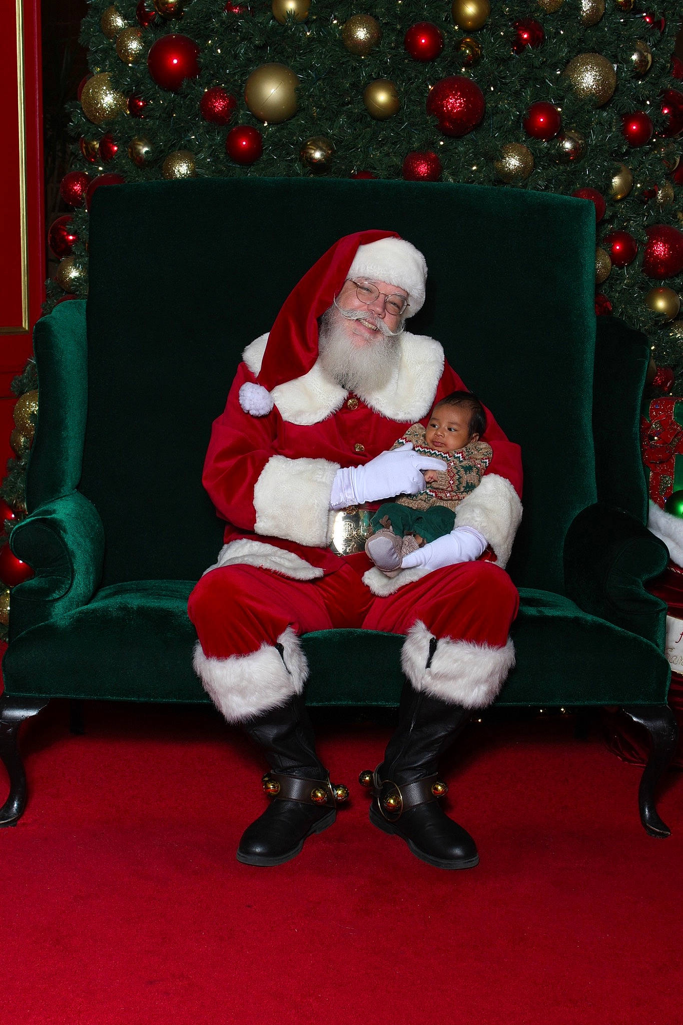 Matthias joined the competition — help win amazing prizes! boot, christmas, christmas_decoration, christmas_eve, christmas_ornament, christmas_tree, costume_hat, event, fictional_character, fun, happy, hat, headwear, holiday, lap, person, plant, red, santa_claus, smile