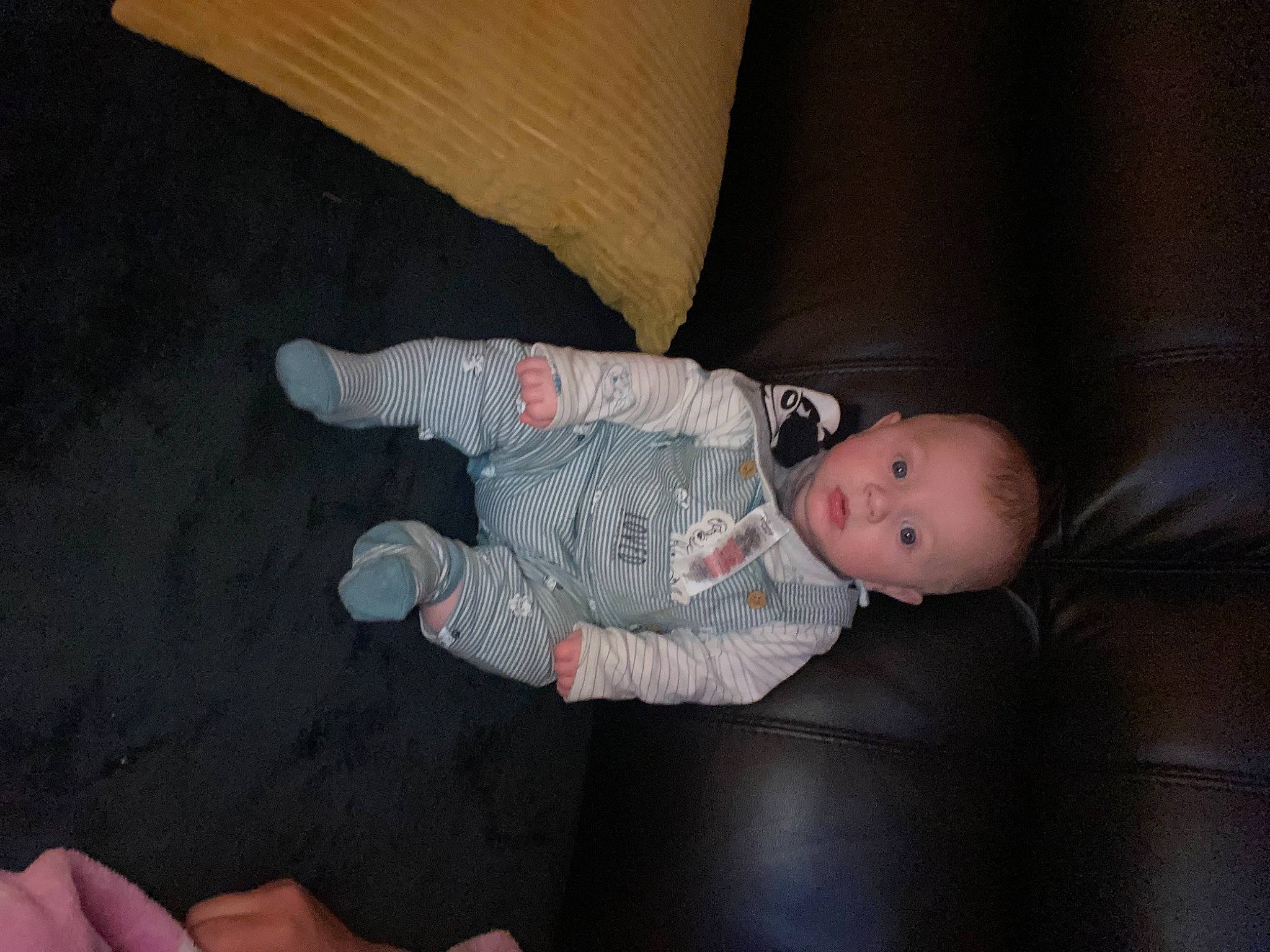 Jamie is registered to the contest to win money with this photo: baby, baby_toddler_clothing, child, comfort, elbow, finger, floor, flooring, foot, fun, human_leg, knee, lap, linens, person, room, skin, sleeve, sock, toddler