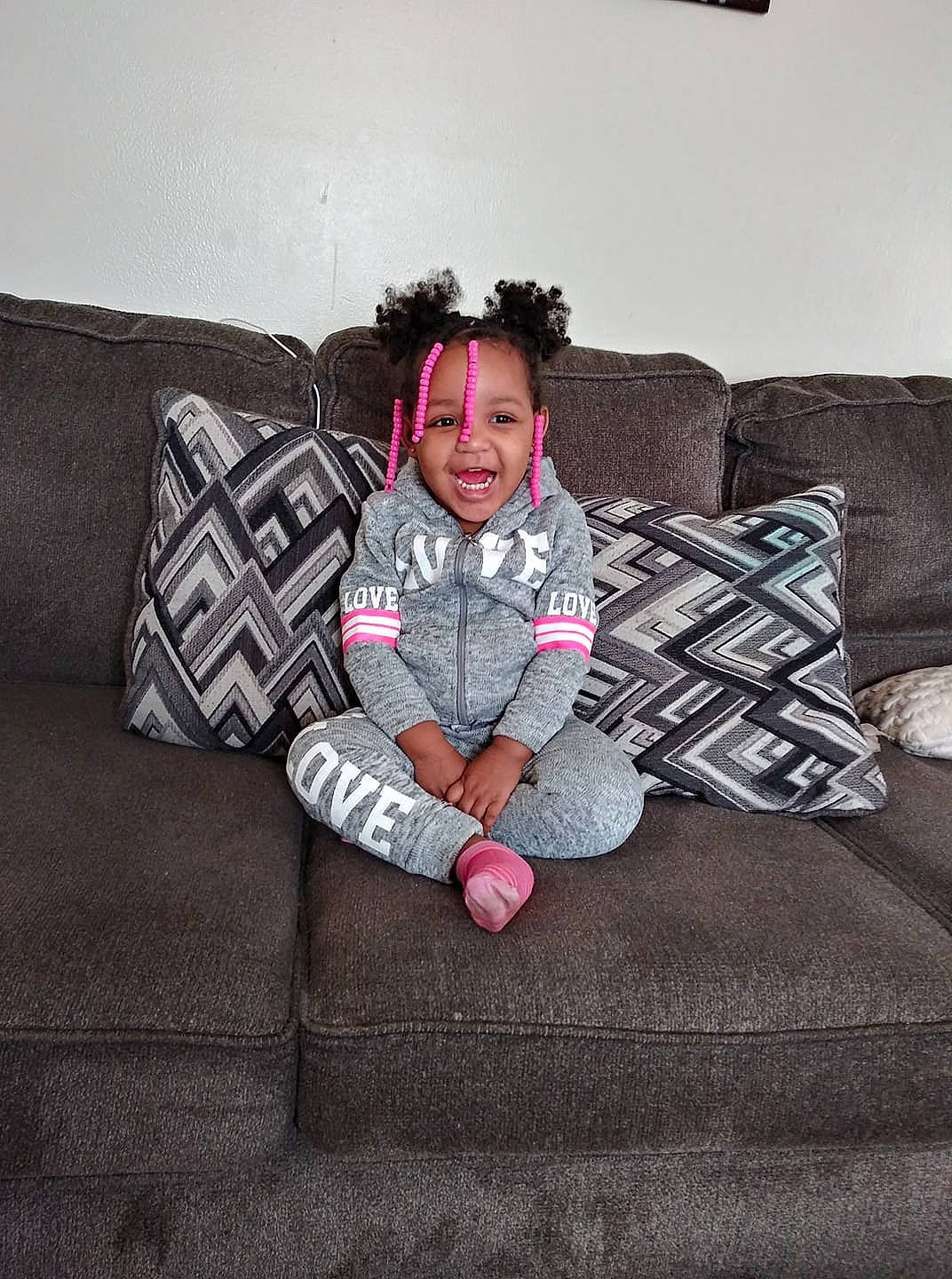 Imani is registered to the contest to win money with this photo: cool, design, fun, furniture, girl, joy, pattern, person, photograph, photography, product, sitting, textile