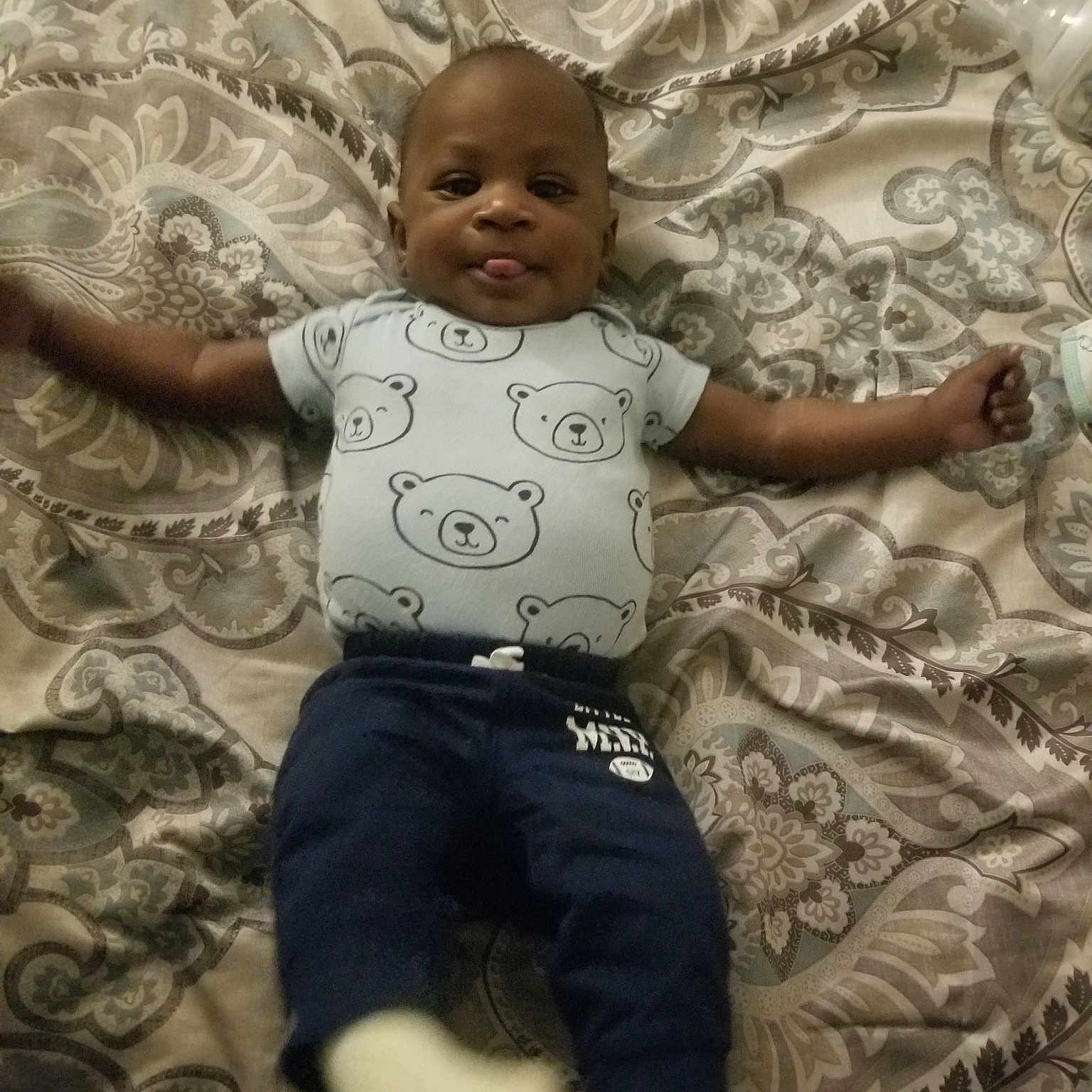 Jahleel is registered to the contest to win money with this photo: arm, child, cool, day, facial_expression, fun, girl, happiness, human, infant, pattern, person, product, sitting, skin, smile, toddler