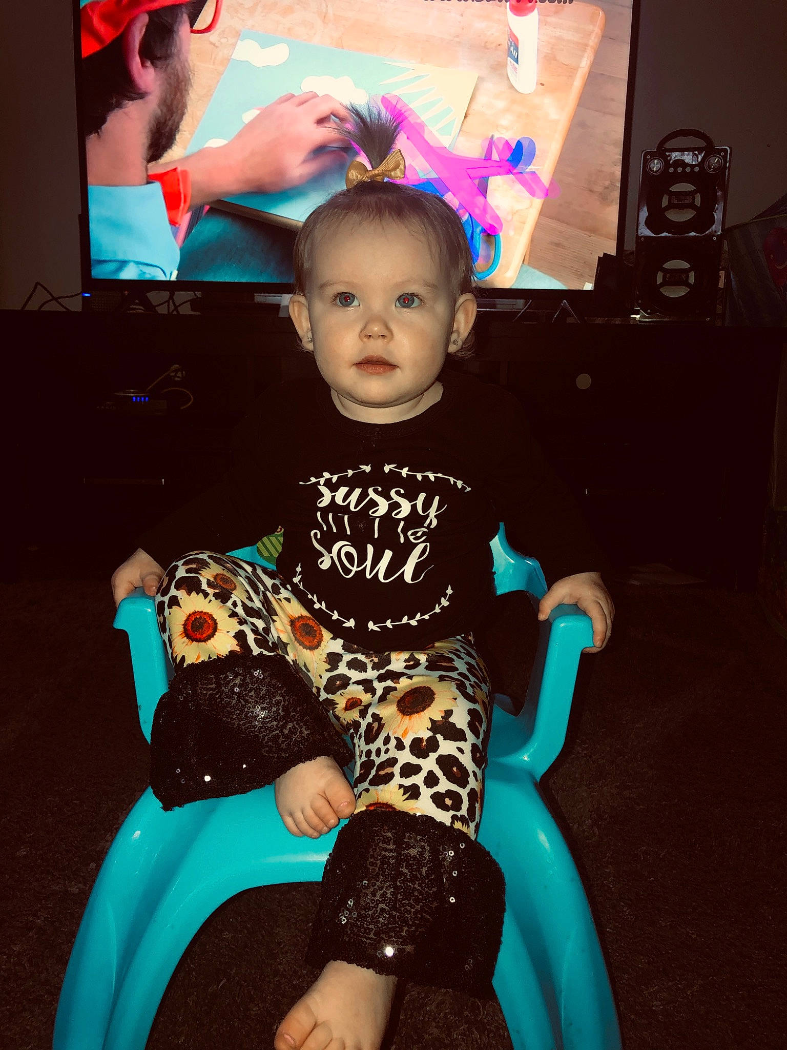 Nova is registered to the contest to win money with this photo: chair, child, cool, family, fun, leg, person, play, shoe, sitting, skin, smile, toddler, turquoise, vacation