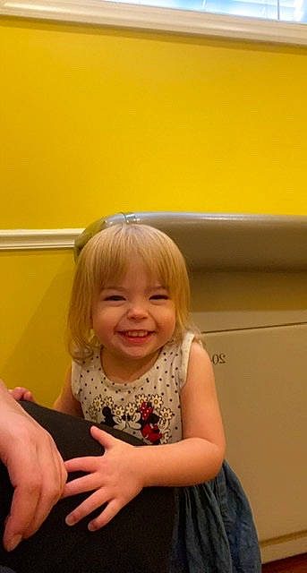 Clementine joined the competition — help win amazing prizes! arm, blond, cheek, dress, finger, fun, gesture, hand, happy, head, human_leg, iris, joy, person, room, shoulder, sitting, skin, smile, thumb