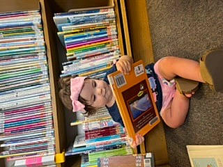 Bayleigh joined the competition — help win amazing prizes! art, artist, book, bookcase, bookselling, chair, child, collection, fun, headwear, library, machine, person, publication, retail, room, shelf, shelving, stationery, t_shirt