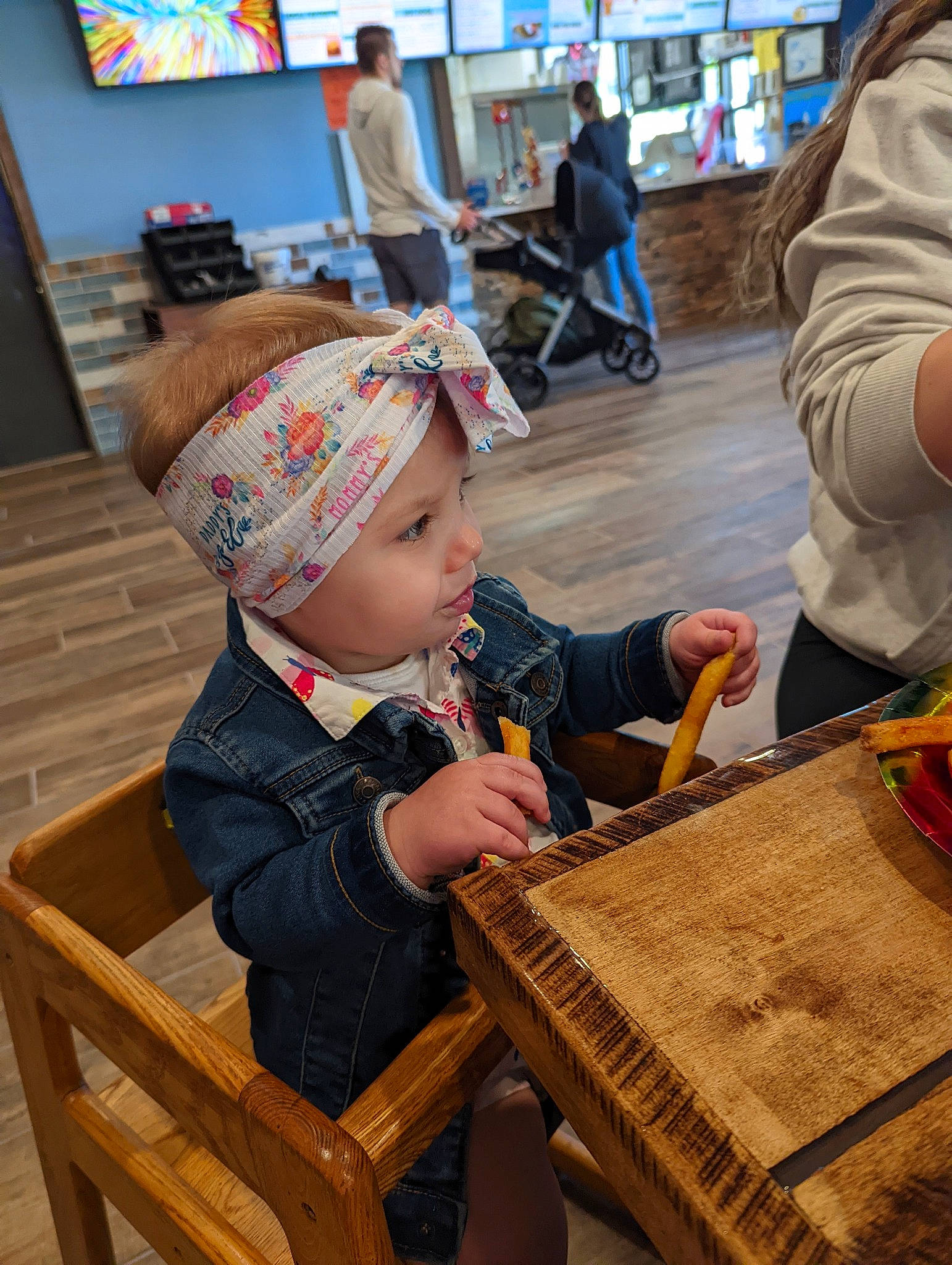 Oaklee is registered to the contest to win money with this photo: baby, baby_toddler_clothing, bag, basket, cap, chair, child, event, flooring, fun, hat, headwear, leisure, luggage_and_bags, person, picture_frame, recreation, room, sitting, table