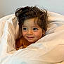 toddler, child, blanket, white, smile, face, hair, blue_eyes, skin, indoors, portrait, cute, cozy, expression, baby, young_child, comfort, warmth, wrapped, soft