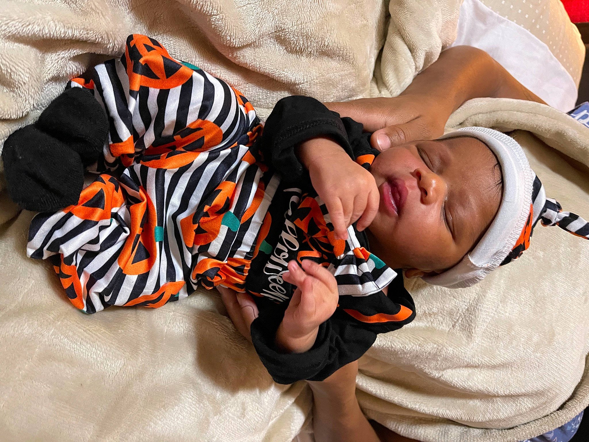 August joined the competition — help win amazing prizes! baby, baby_toddler_clothing, carmine, child, comfort, elbow, finger, font, happy, headwear, linens, nail, orange, pattern, person, room, sitting, sleeve, t_shirt, thigh