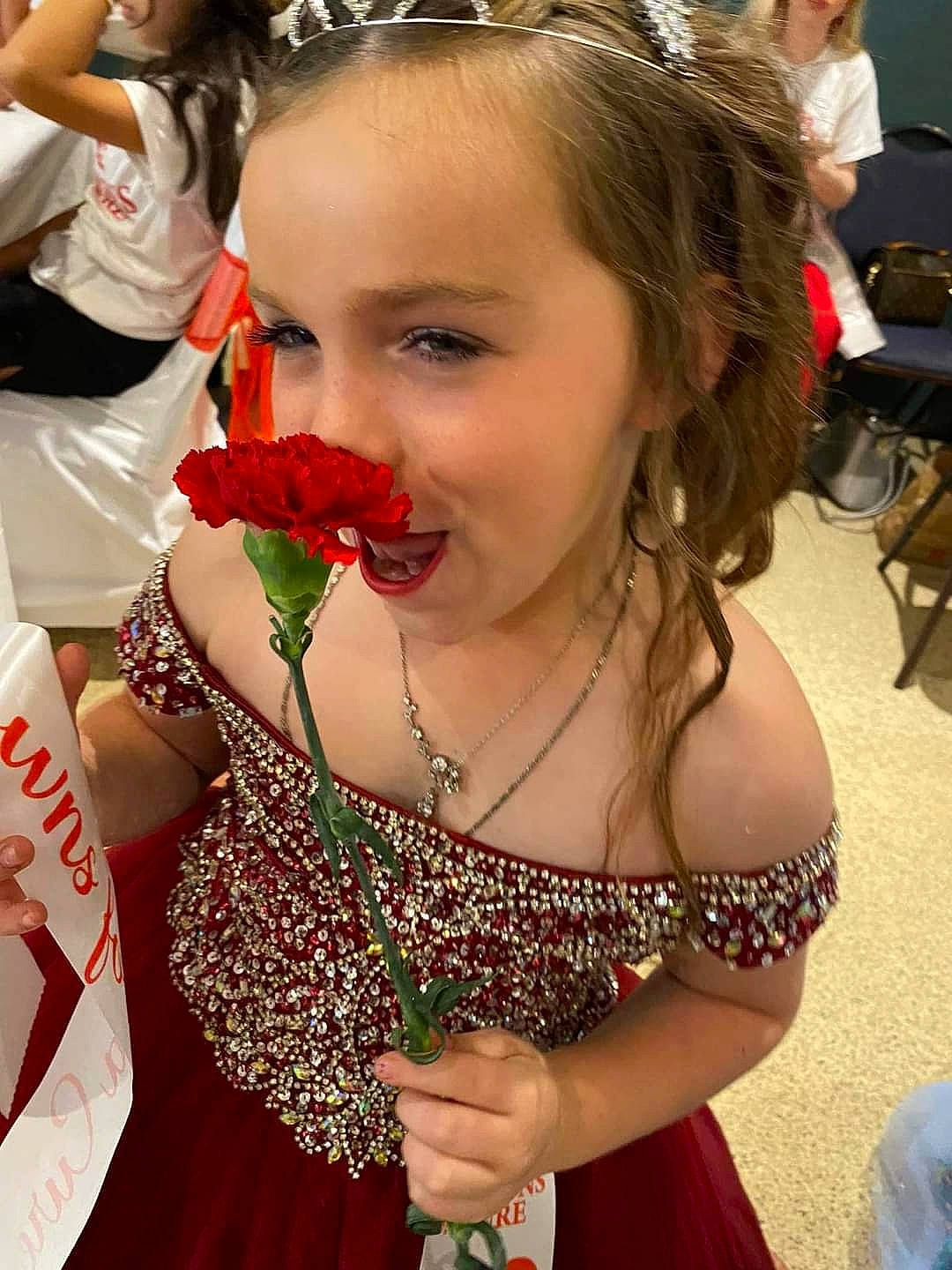 Ashlee joined the competition — help win amazing prizes! beauty, chair, event, facial_expression, fashion, flower, flower_arranging, fun, gesture, hairstyle, happy, headpiece, human, jewellery, lei, necklace, person, petal, summer, tradition