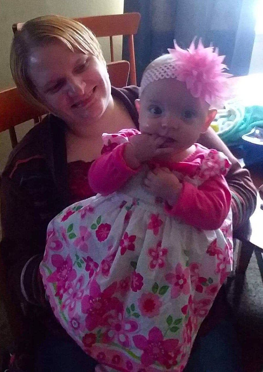 Scarlette is registered to the contest to win money with this photo: cheek, child, doll, ear, eye, face, head, iris, joy, magenta, person, pink, plant, play, stuffed_toy, toddler, toy