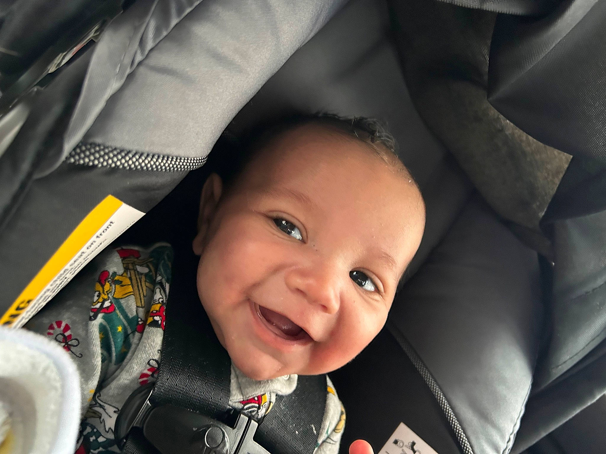 Wyatt is registered to the contest to win money with this photo: auto_part, automotive_design, baby, baby_carriage, baby_products, car_seat, carmine, cheek, child, comfort, eyebrow, fun, happy, head_restraint, joy, nose, person, seat_belt, smile, toddler