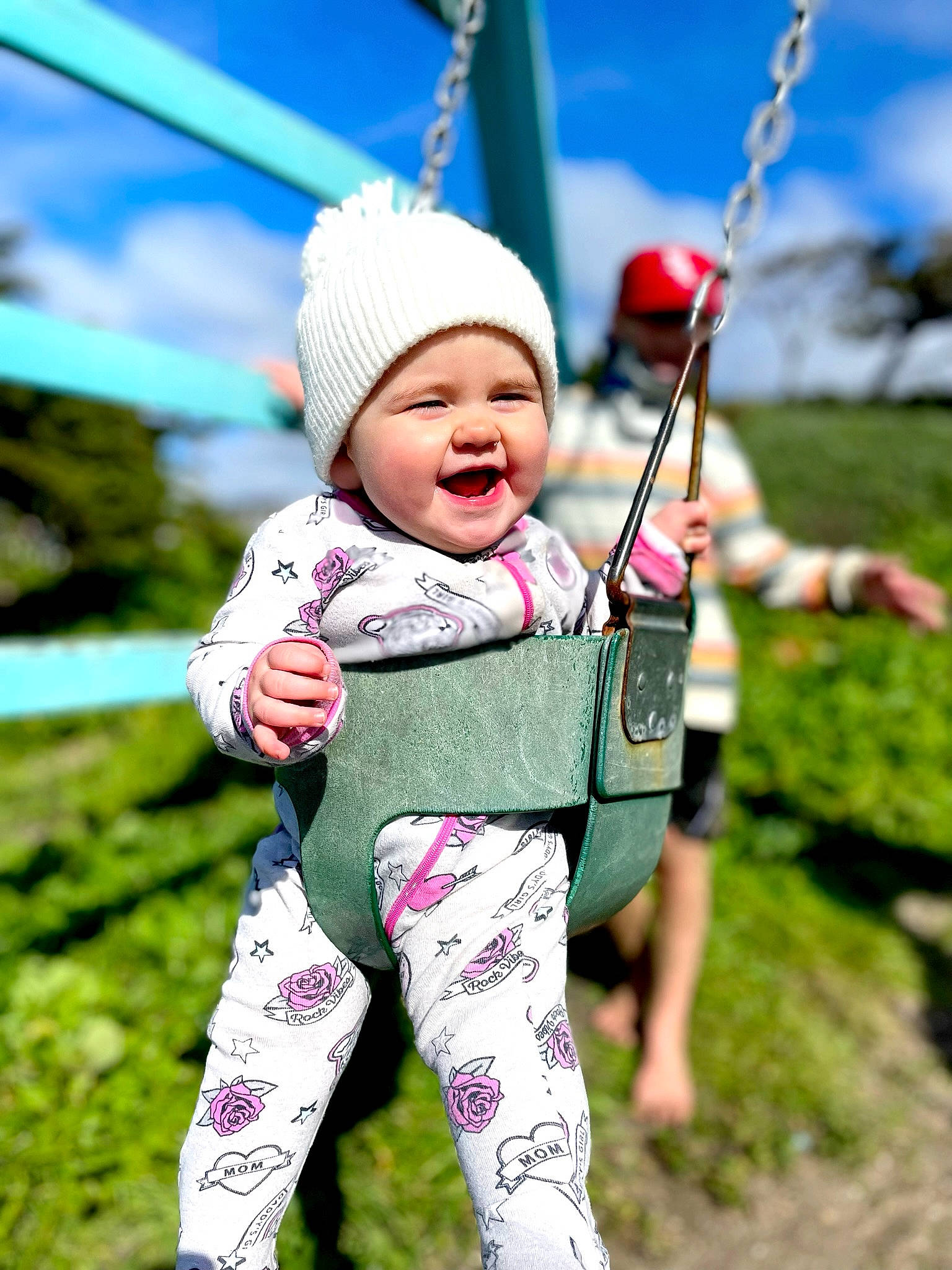 Alley is registered to the contest to win money with this photo: baby, baby_toddler_clothing, cap, child, eye, face, fun, grass, happy, headwear, leisure, people_in_nature, person, pink, play, playground, recreation, sky, sleeve, smile