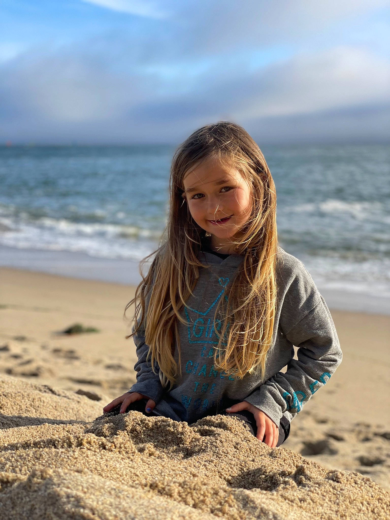 Madison is registered to the contest to win money with this photo: azure, beach, cloud, flash_photography, fun, grass, hair, happy, horizon, joy, landscape, leisure, long_hair, people_in_nature, person, sand, sky, smile, sunlight, travel