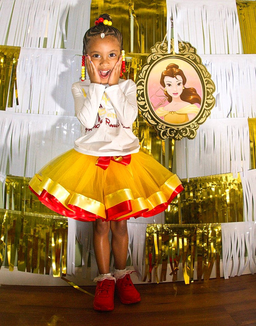 Randi joined the competition — help win amazing prizes! baby_toddler_clothing, ballet_tutu, child, costume, dancer, entertainment, event, fashion_design, fun, happy, magenta, peach, performing_arts, person, pink, plant, recreation, ruffle, smile, toddler