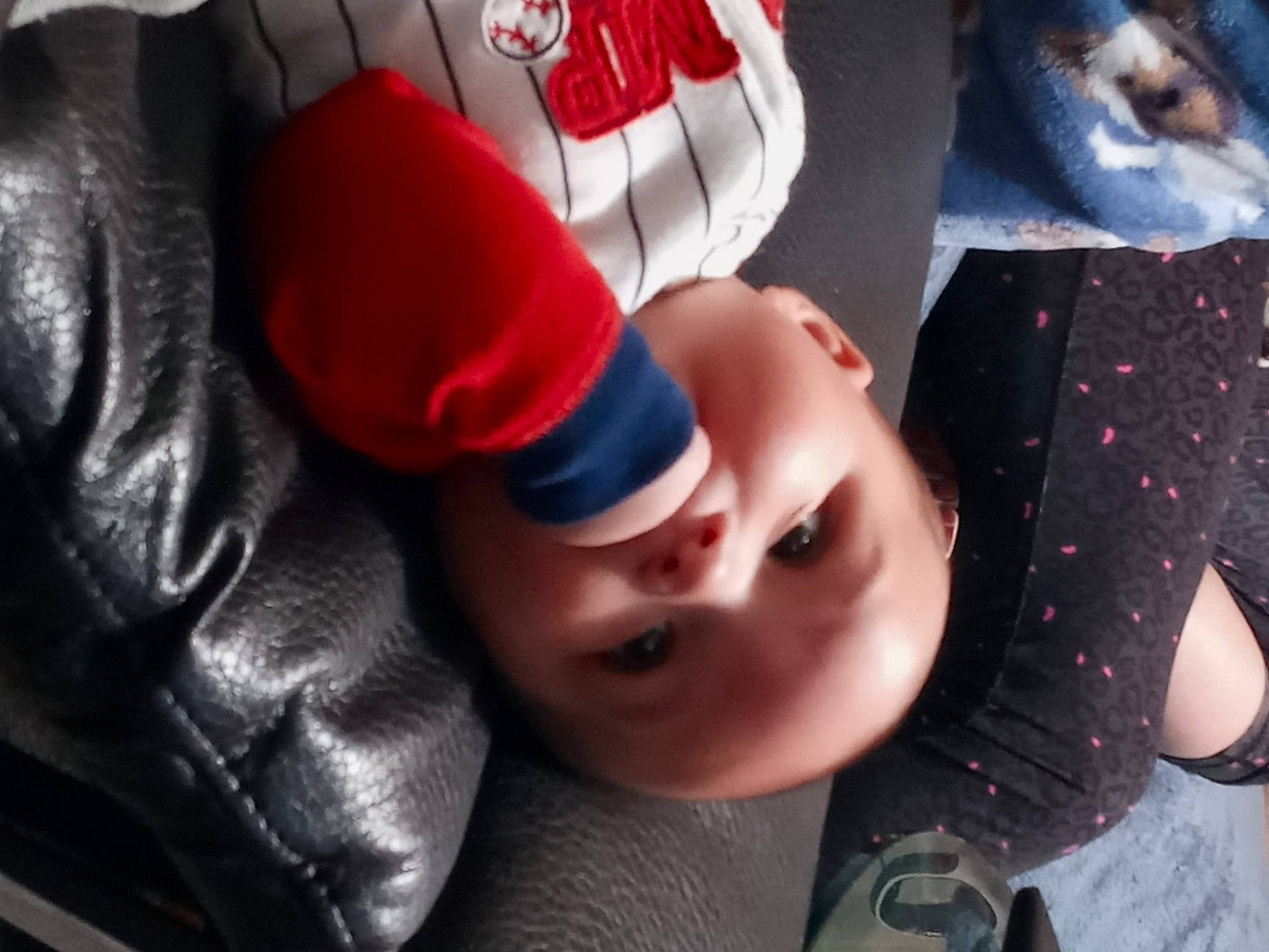 Jareth is registered to the contest to win money with this photo: baby, cap, carmine, cheek, child, comfort, eyelash, fashion_accessory, flash_photography, fun, happy, headgear, lip, mouth, nose, pattern, person, personal_protective_equipment, product, textile