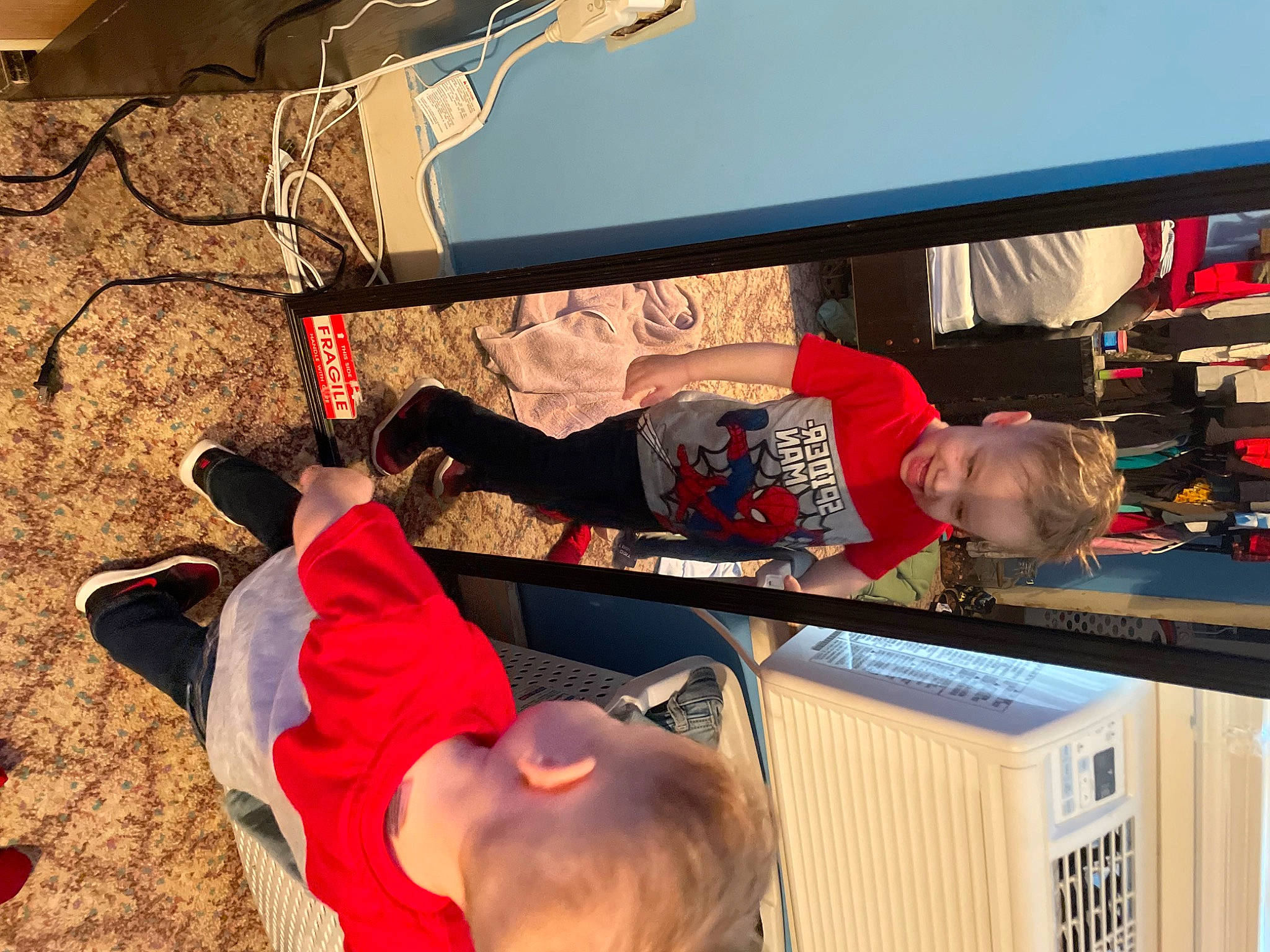 Tobias is registered to the contest to win money with this photo: automotive_design, automotive_exterior, building, child, clothing, flooring, fun, hat, joy, leisure, machine, person, play, product, recreation, room, shelf, shelving, t_shirt, tire