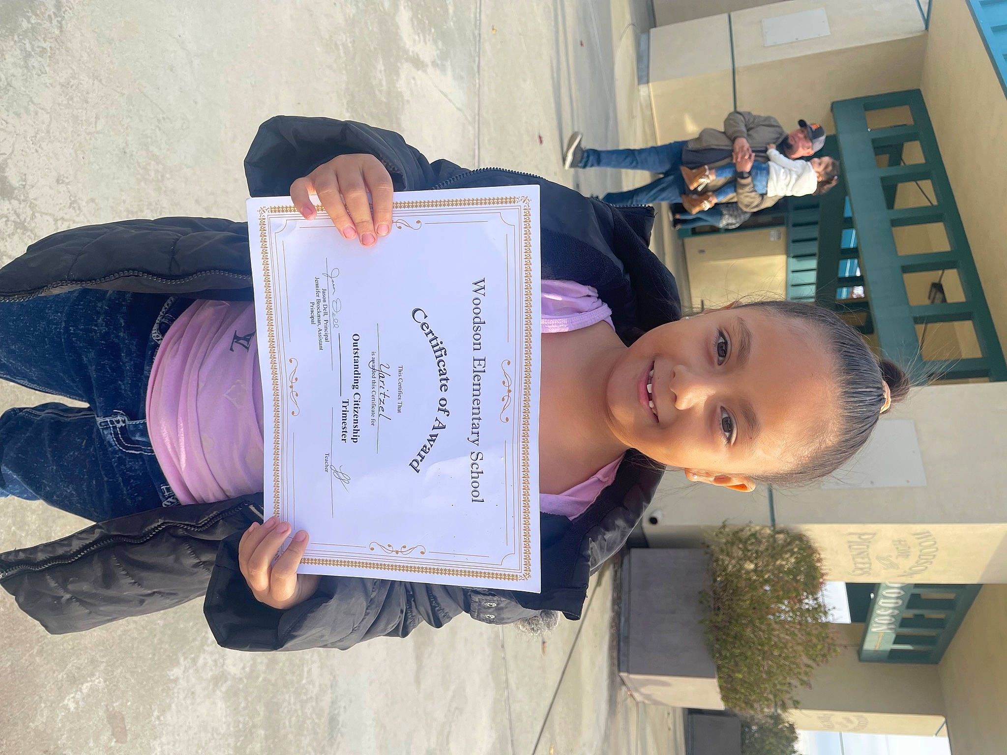 Yaritzel joined the competition — help win amazing prizes! building, child, handwriting, hat, joy, person, plant, room, sitting, smile, writing